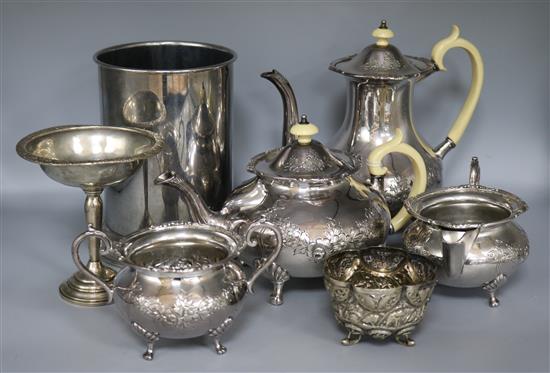 A sterling silver tazza (weighted), Indian embossed white metal bowl, four piece plated tea service and a Tawlite wine cooler
